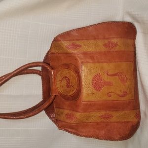 Handmade Tooled leather women's handbag, African motif .